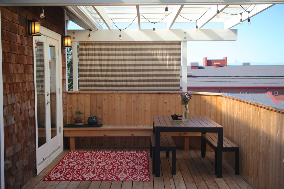 Inspiration for a mid-sized craftsman backyard deck remodel in Seattle with a pergola