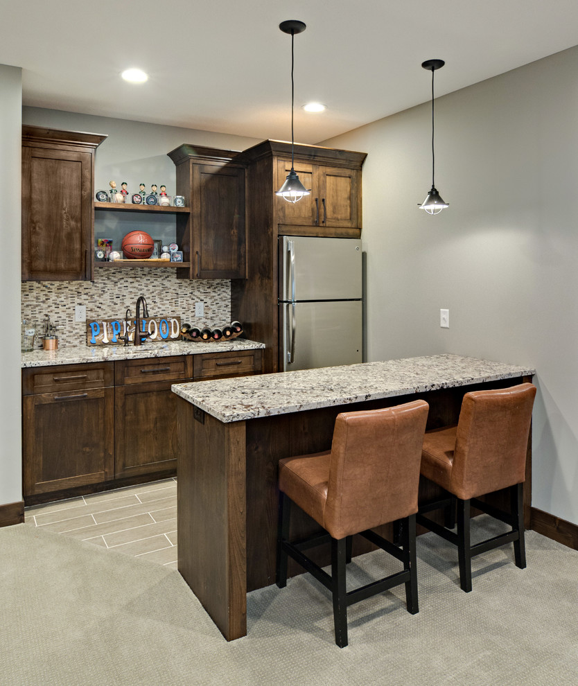 Mid-sized transitional galley wet bar in Minneapolis with an undermount sink, flat-panel cabinets, dark wood cabinets, granite benchtops, brown splashback, mosaic tile splashback and ceramic floors.