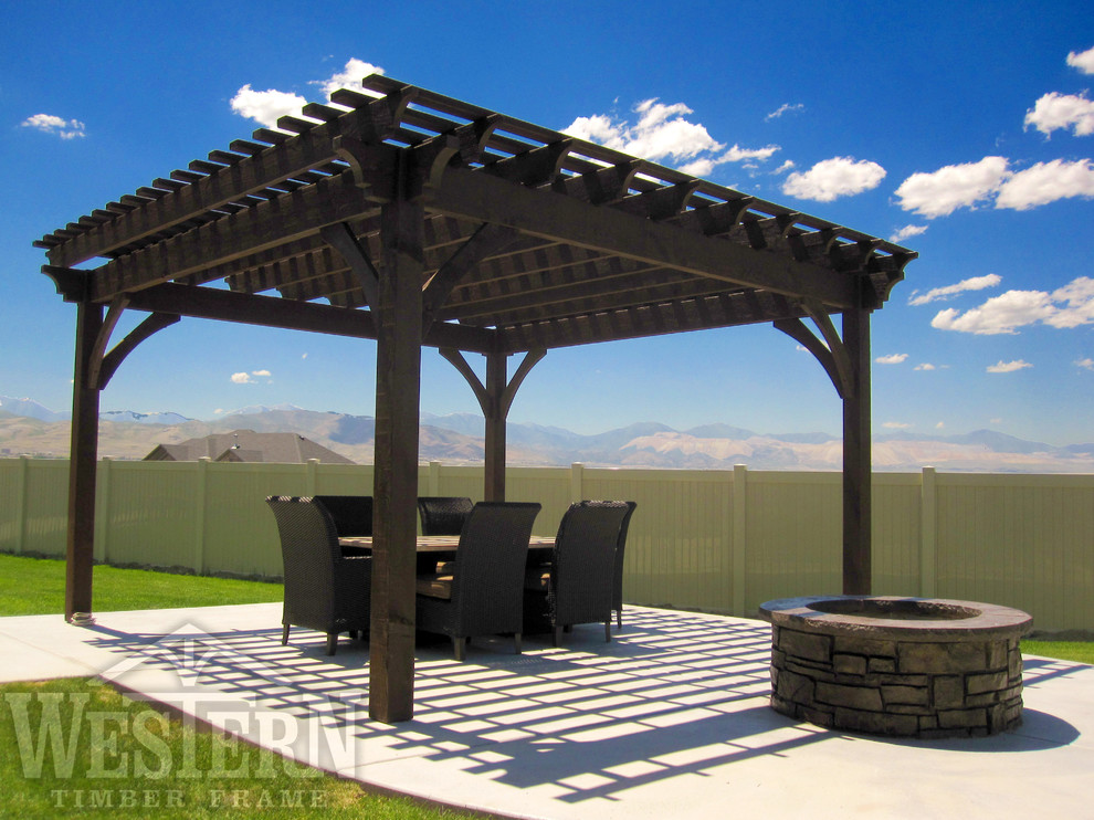 Example of a trendy backyard patio design in Salt Lake City with a fire pit and a pergola