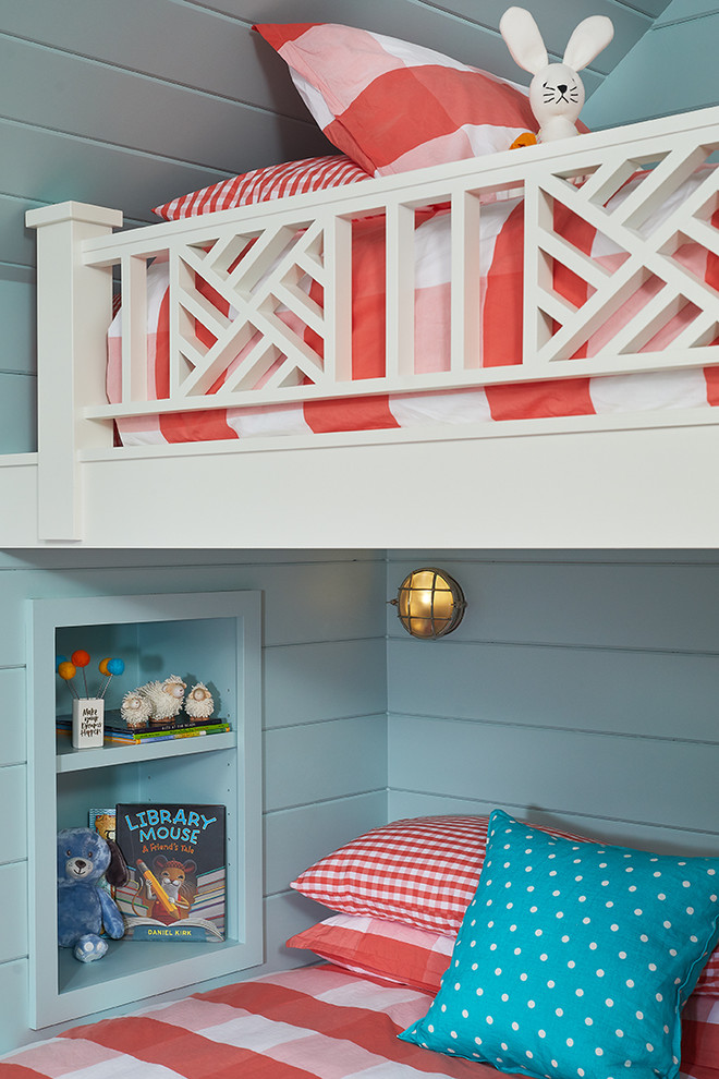 Beach House Bunk Room - In this formerly unfinished room above a garage, we were tasked with creating the ultimate kids’ space that could easily be used for adult guests as well. Our space was limited, but our client’s imagination wasn’t! Bold, fun, summertime colors, layers of pattern, and a strong emphasis on architectural details make for great vignettes at every turn.

With many collaborations and revisions, we created a space that sleeps 8, offers a game/project table, a cozy reading space, and a full bathroom. The game table and banquette, bathroom vanity, locker wall, and unique bunks were custom designed by Bayberry Cottage and all allow for tons of clever storage spaces.

This is a space created for loved ones and a lifetime of memories of a fabulous lakefront vacation home!