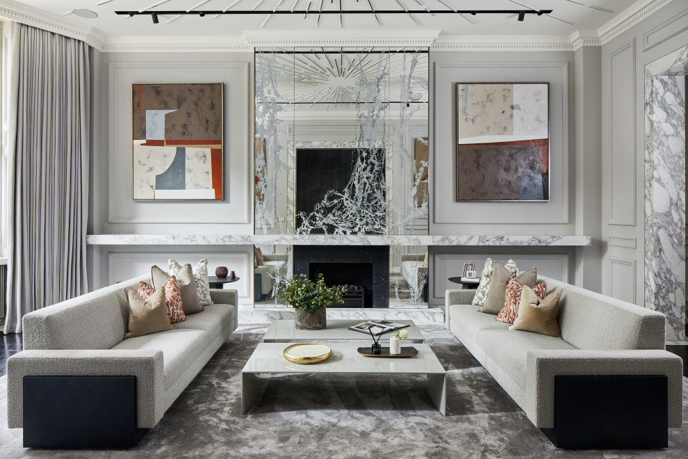 Photo of a contemporary formal enclosed living room in London with grey walls, a standard fireplace and wainscoting.