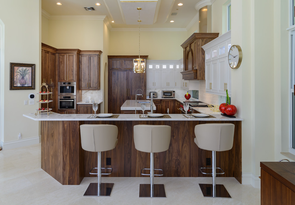 Open concept kitchen - mid-sized transitional u-shaped porcelain tile and beige floor open concept kitchen idea in Miami with a single-bowl sink, shaker cabinets, dark wood cabinets, quartzite countertops, white backsplash, glass tile backsplash, paneled appliances and white countertops