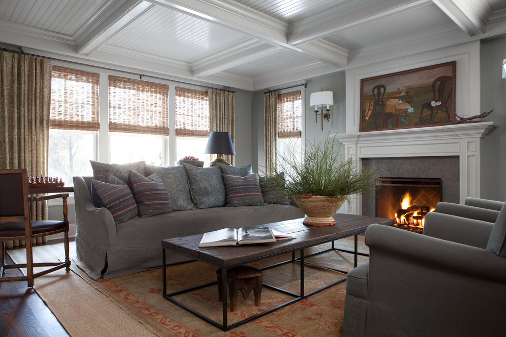 This is an example of a mid-sized traditional formal enclosed living room in Chicago with grey walls, dark hardwood floors, a standard fireplace, a stone fireplace surround and no tv.