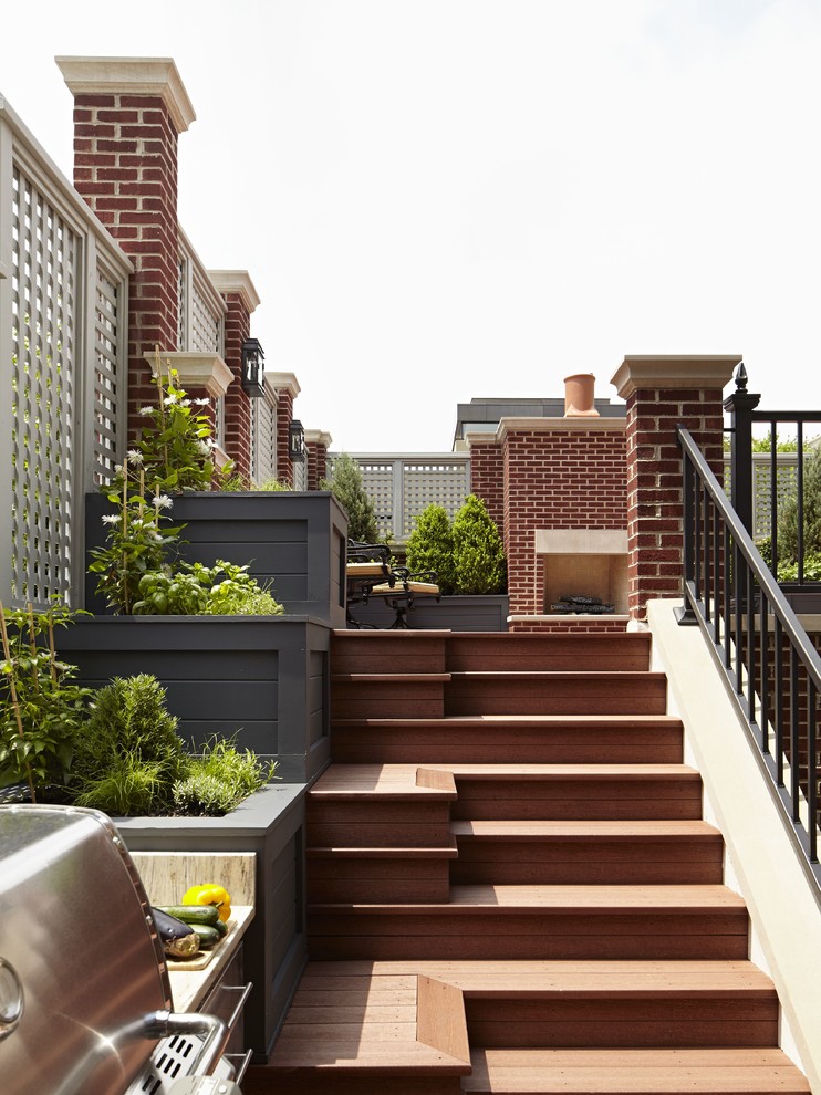 Design ideas for a large transitional rooftop deck in Chicago with an outdoor kitchen.