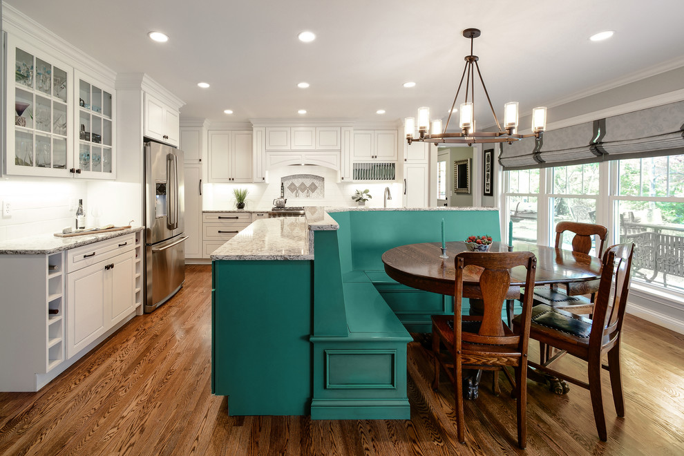 Design ideas for a mid-sized contemporary kitchen/dining combo in St Louis with white walls and dark hardwood floors.
