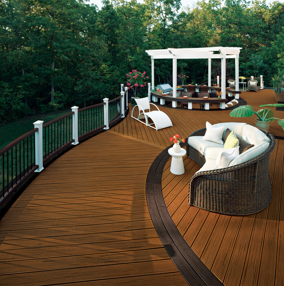 Photo of an expansive tropical backyard deck in DC Metro with an outdoor kitchen and no cover.