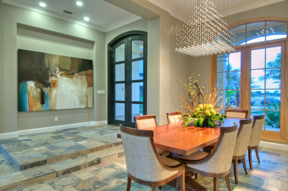 This is an example of a contemporary dining room in Tampa with grey walls.