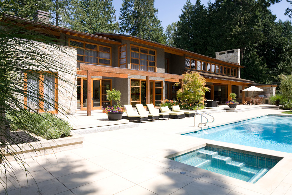 Design ideas for a contemporary exterior in Vancouver with stone veneer.