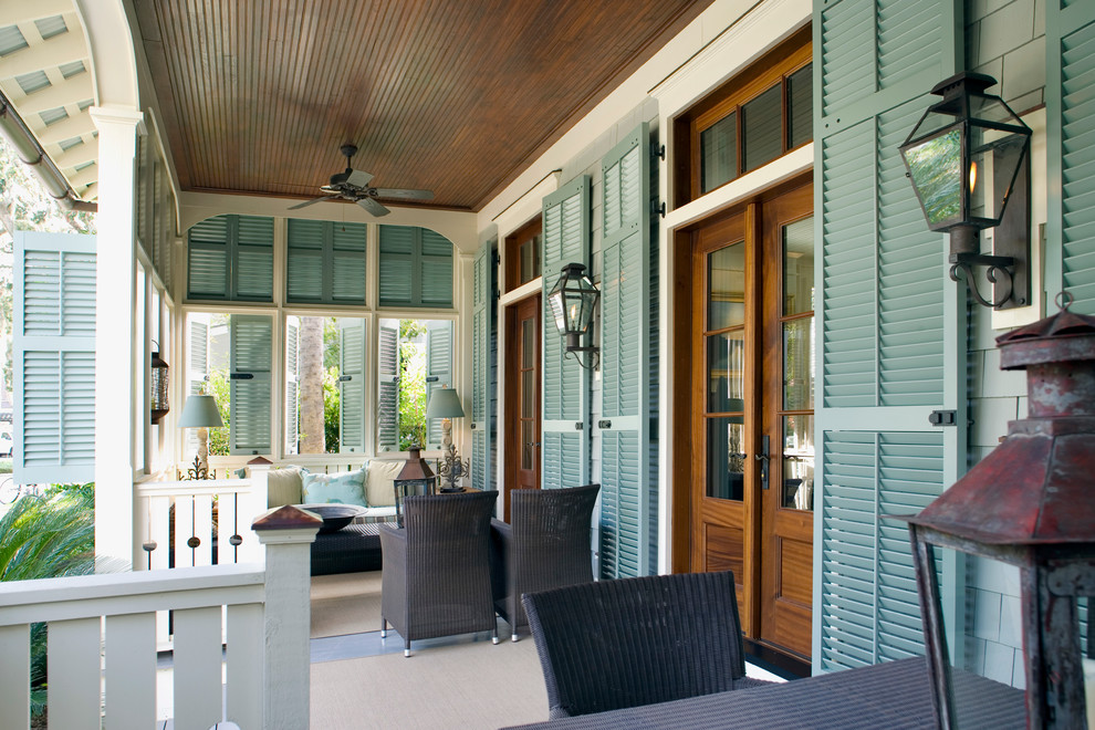 Beach style porch idea in Atlanta with a roof extension