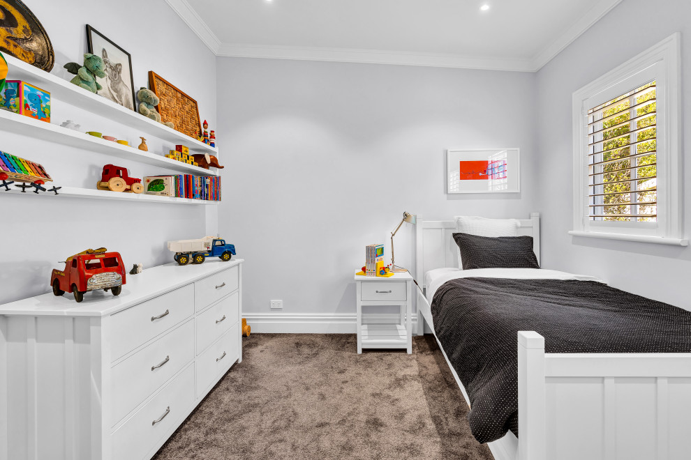 This is an example of a small traditional gender neutral children’s room in Auckland with grey walls, carpet, brown floors and a coffered ceiling.