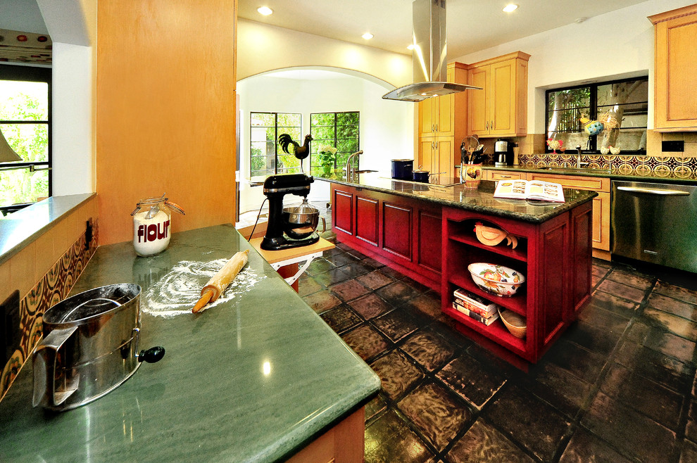 Large mediterranean u-shaped eat-in kitchen in Los Angeles with an undermount sink, recessed-panel cabinets, red cabinets, quartzite benchtops, red splashback, ceramic splashback, stainless steel appliances and terra-cotta floors.