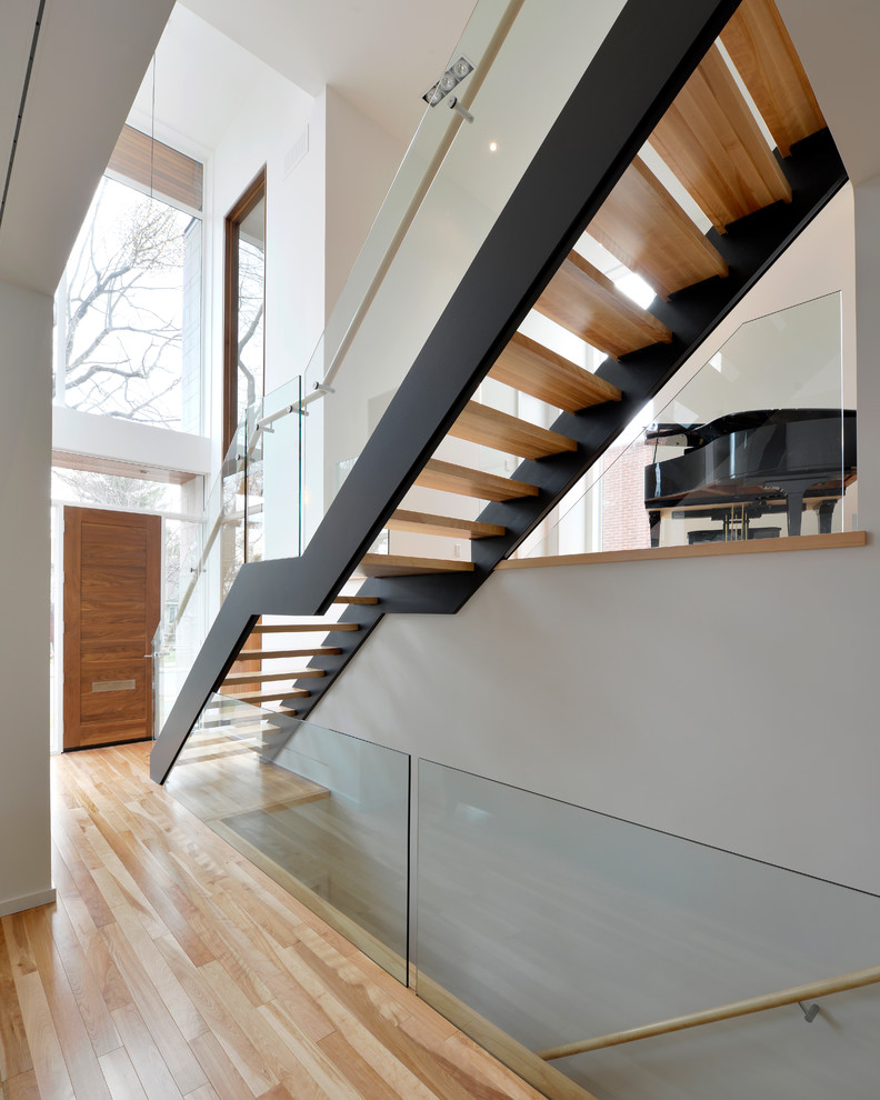 Inspiration for a modern floating staircase in Ottawa with open risers.
