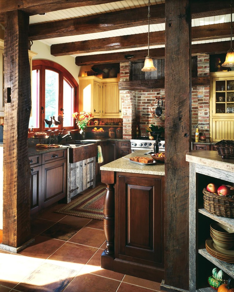 Enclosed kitchen - mid-sized rustic l-shaped terra-cotta tile and beige floor enclosed kitchen idea in DC Metro with a farmhouse sink, raised-panel cabinets, medium tone wood cabinets, granite countertops, multicolored backsplash, brick backsplash, stainless steel appliances and an island