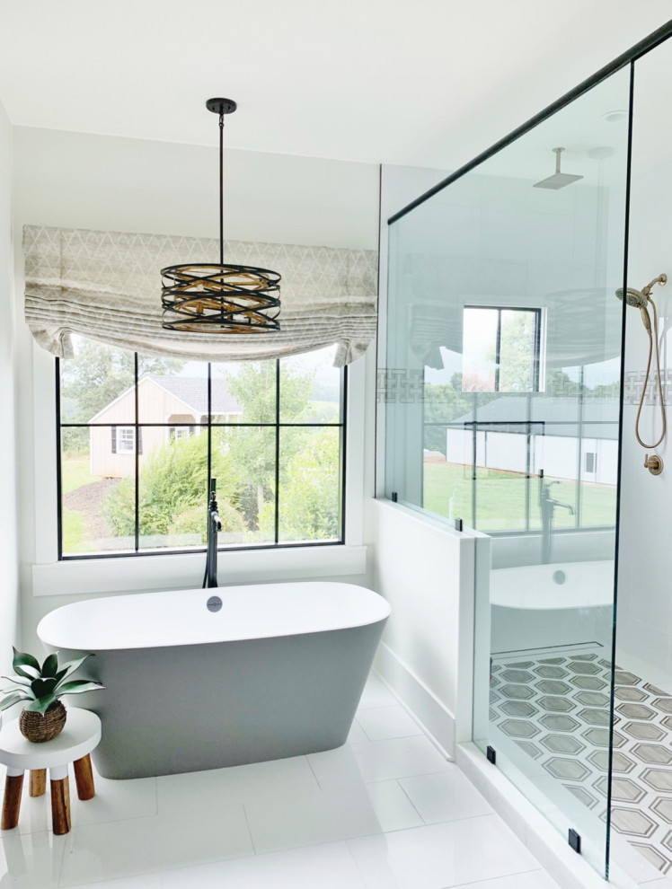 Photo of a large modern master bathroom in Atlanta with shaker cabinets, black cabinets, a freestanding tub, an open shower, a two-piece toilet, white tile, porcelain tile, white walls, porcelain floors, an undermount sink, engineered quartz benchtops, white floor, an open shower, white benchtops, a niche, a single vanity and a built-in vanity.