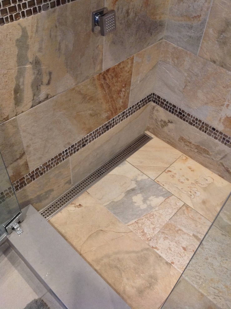 Design ideas for a mid-sized transitional master bathroom in Oklahoma City with an alcove tub, a corner shower, multi-coloured tile, glass tile, purple walls and porcelain floors.