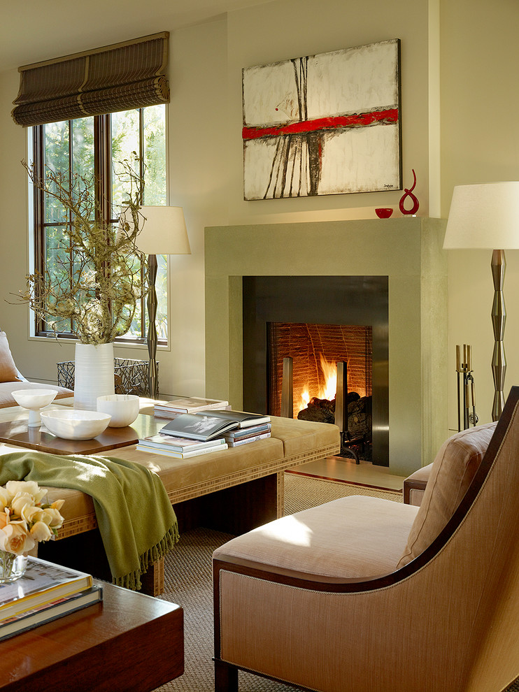 This is an example of a contemporary formal living room in San Francisco with beige walls and a standard fireplace.
