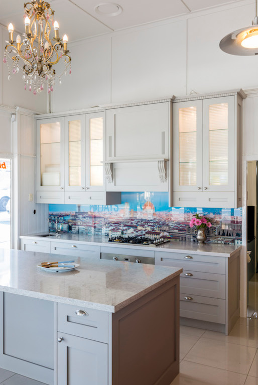 Photo of a small eclectic galley eat-in kitchen in Brisbane with an undermount sink, shaker cabinets, grey cabinets, quartz benchtops, glass sheet splashback, stainless steel appliances, porcelain floors and no island.