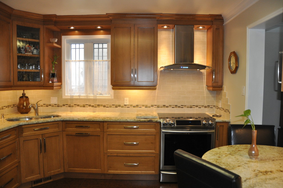 Example of a small l-shaped ceramic tile enclosed kitchen design in Ottawa with an undermount sink, shaker cabinets, medium tone wood cabinets, granite countertops, beige backsplash, ceramic backsplash, stainless steel appliances and no island