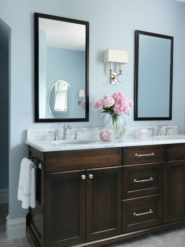 Inspiration for a mid-sized traditional master bathroom in St Louis with shaker cabinets, dark wood cabinets, marble benchtops, blue walls, a double shower, a two-piece toilet, gray tile, stone slab and marble floors.