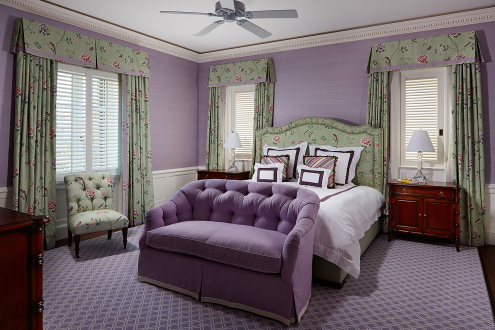 Photo of a mediterranean guest bedroom in Other with purple walls, dark hardwood floors and brown floor.