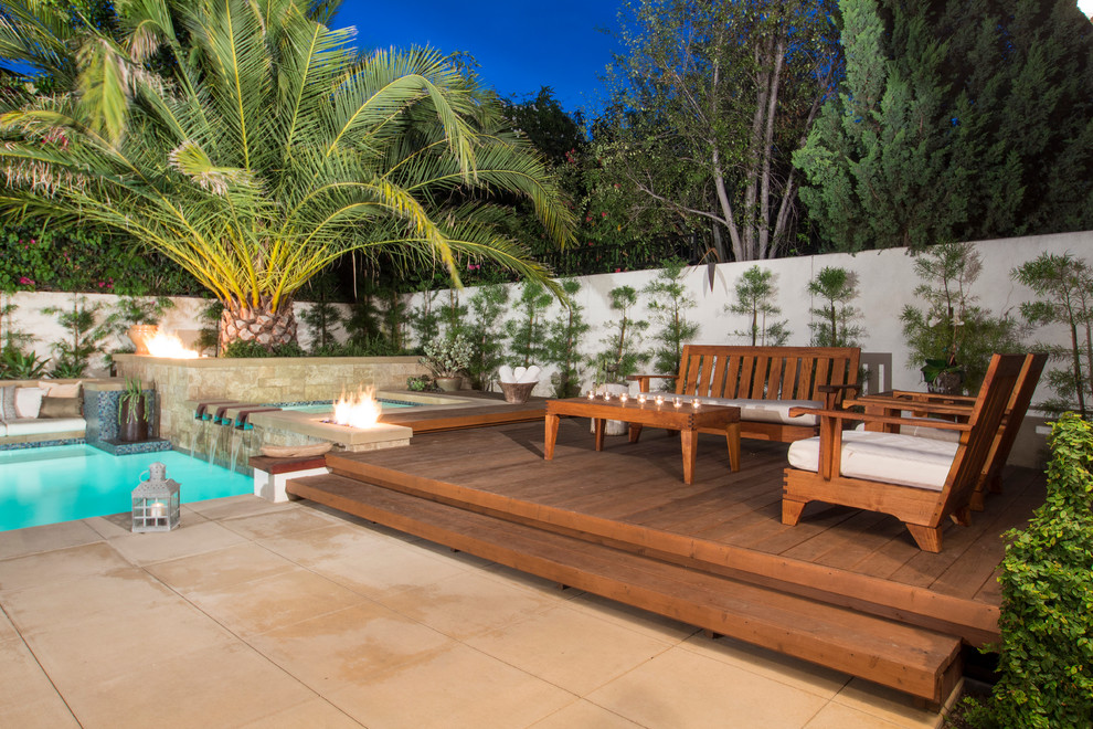 Photo of a mid-sized tropical backyard deck in Orange County with no cover.
