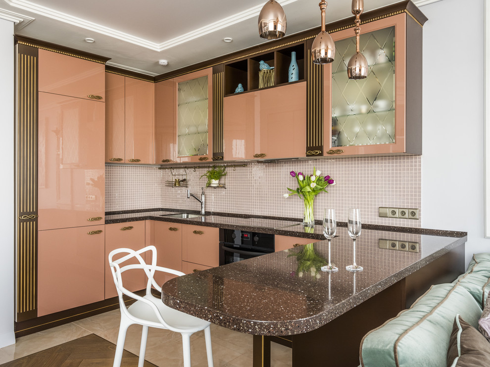 Transitional u-shaped open plan kitchen in Moscow with an undermount sink, flat-panel cabinets, beige splashback, mosaic tile splashback, black appliances, a peninsula, beige floor and brown benchtop.