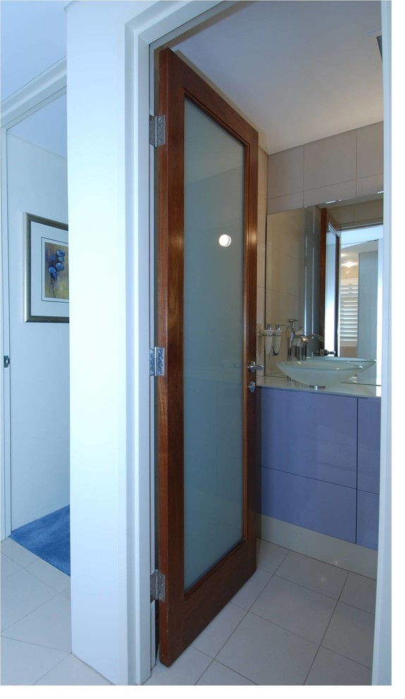 Inspiration for a transitional bathroom in Sydney with flat-panel cabinets, blue cabinets and a vessel sink.