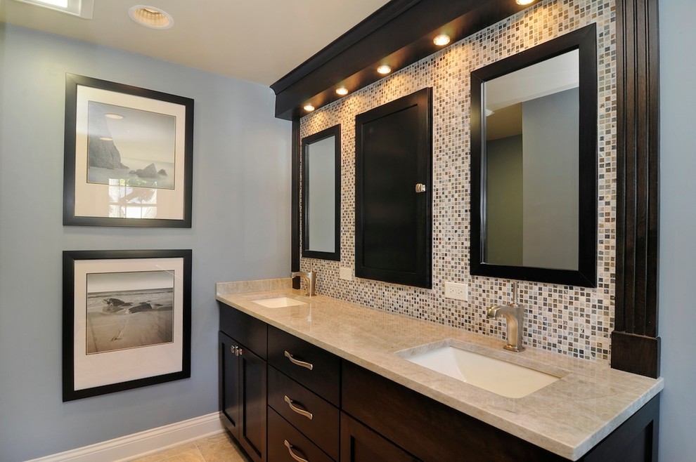 Photo of a small eclectic master bathroom in Chicago with recessed-panel cabinets, dark wood cabinets, an open shower, a one-piece toilet, beige tile, stone tile, blue walls, travertine floors, an undermount sink and granite benchtops.