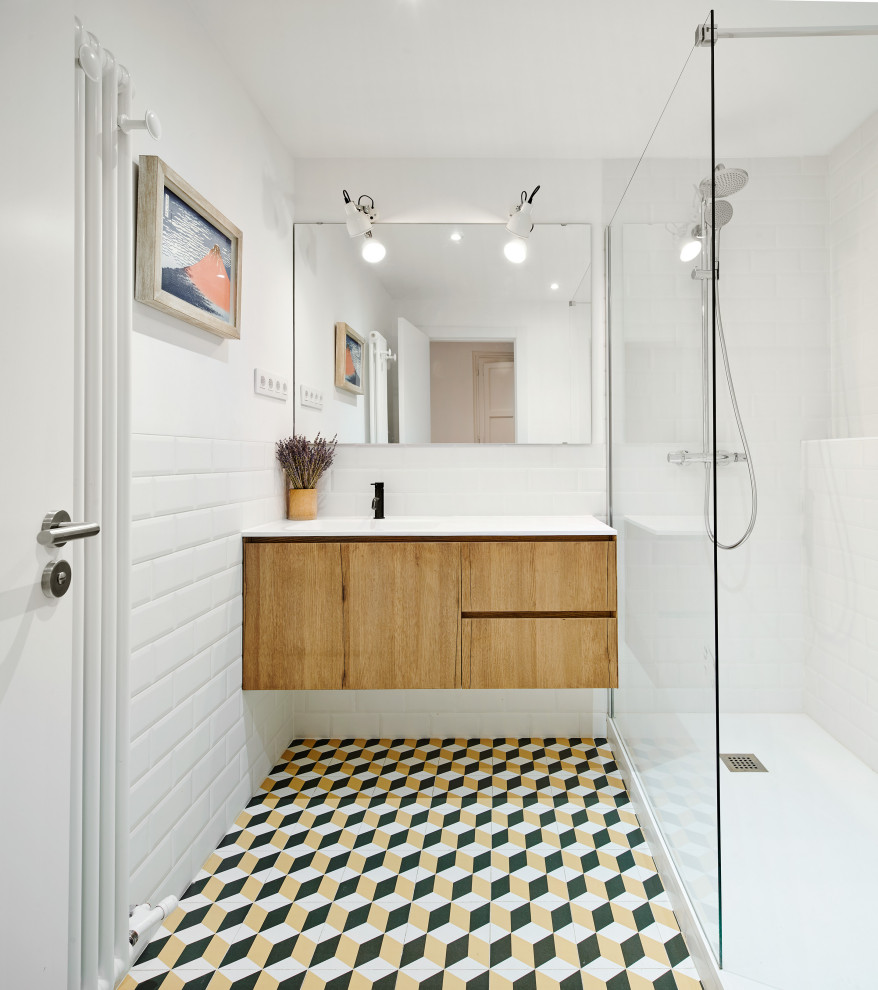 Design ideas for a mid-sized contemporary 3/4 bathroom in Other with flat-panel cabinets, medium wood cabinets, a corner shower, white tile, subway tile, white walls, porcelain floors, multi-coloured floor, an open shower, white benchtops, a floating vanity and a single vanity.