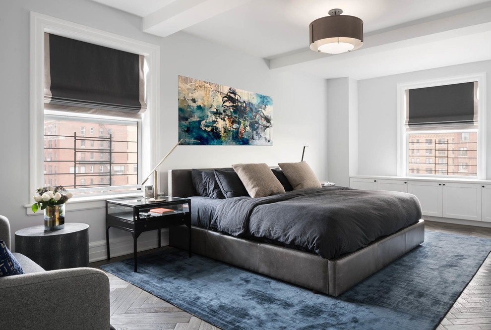 Inspiration for a contemporary master bedroom in New York with white walls, dark hardwood floors and brown floor.