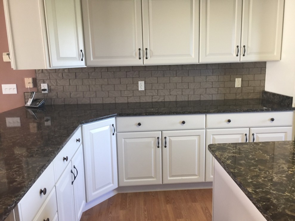 Example of a transitional kitchen design with gray backsplash and glass tile backsplash