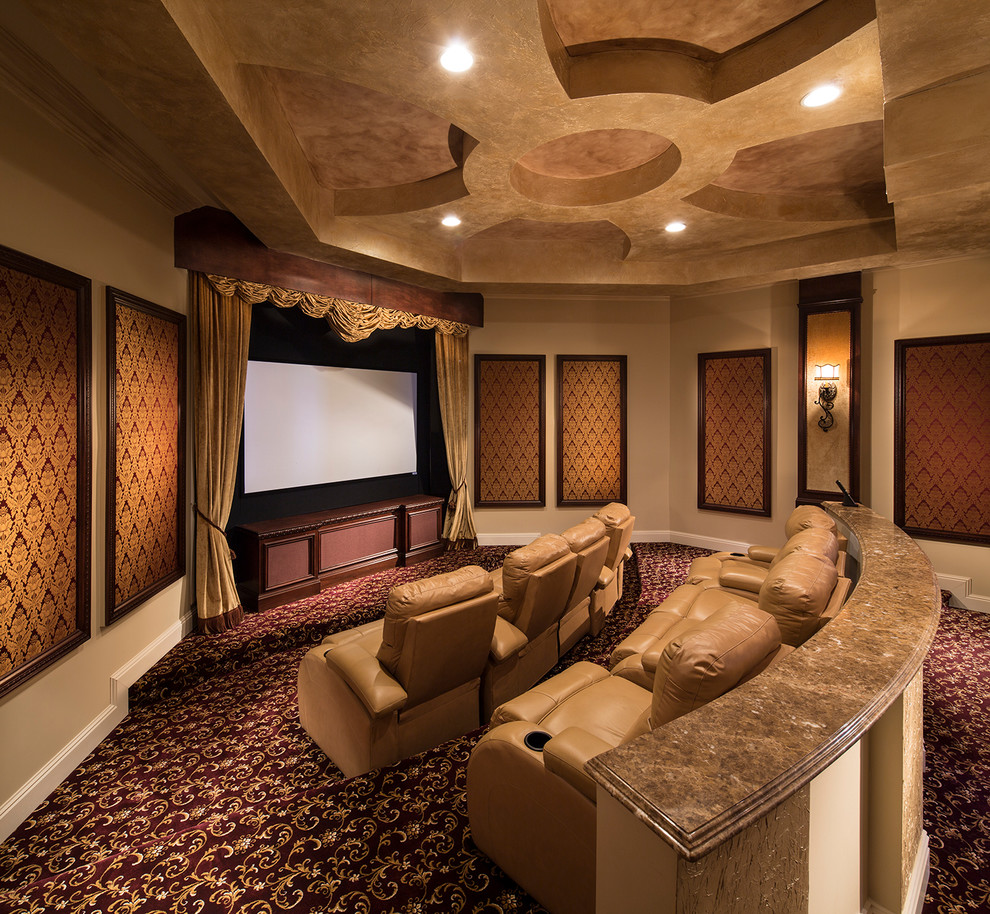 Design ideas for a large mediterranean enclosed home theatre in Miami with beige walls, carpet, multi-coloured floor and a projector screen.