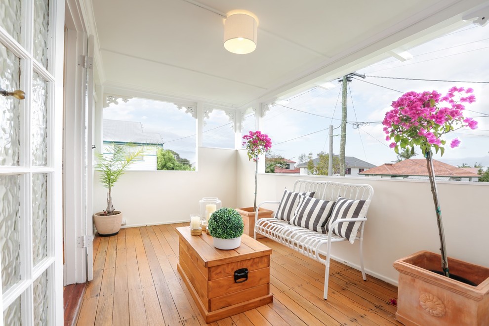 Small scandinavian verandah in Brisbane with a roof extension and decking.