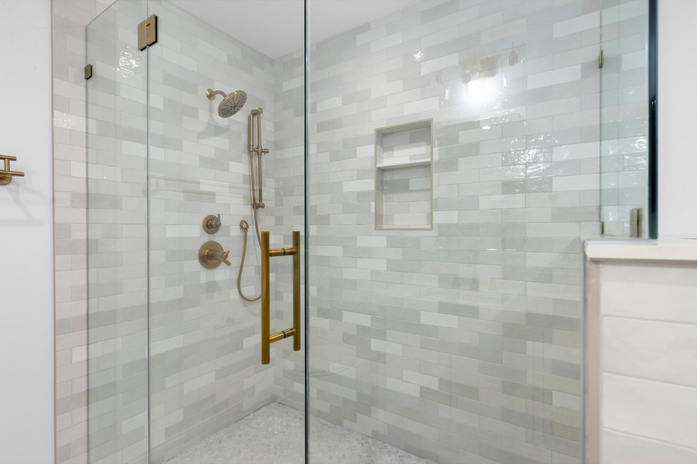 Walk-In Shower with Gold Fixtures and Tile Niche
