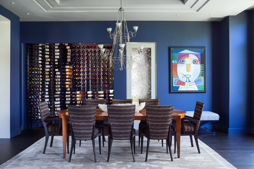 This is an example of a large contemporary separate dining room in Denver with blue walls, dark hardwood floors, no fireplace and brown floor.