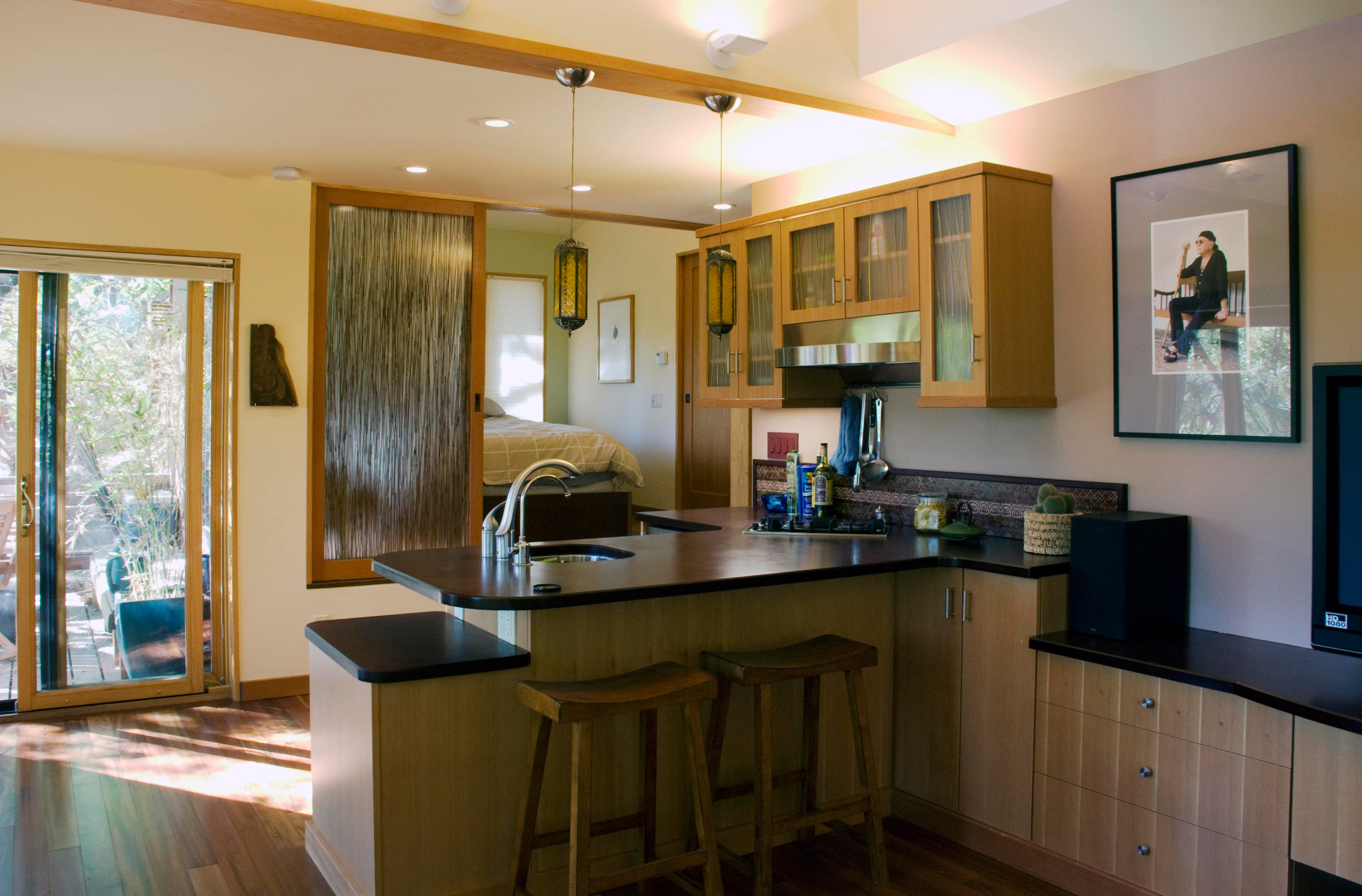 Kitchenette with bedroom beyond