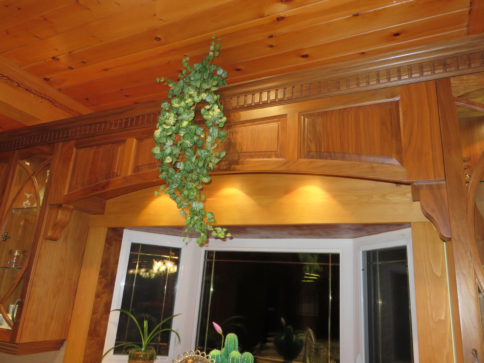 Inspiration for a large transitional l-shaped ceramic tile open concept kitchen remodel with raised-panel cabinets, medium tone wood cabinets, granite countertops, an island, a double-bowl sink, white backsplash, subway tile backsplash and stainless steel appliances