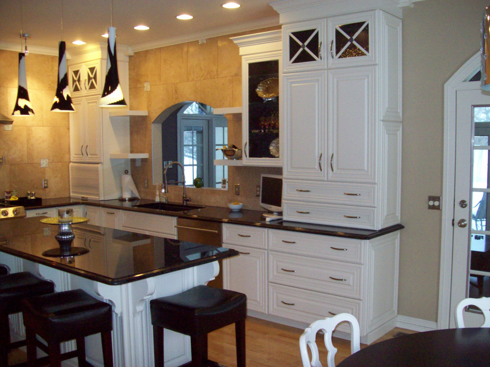 Eat-in kitchen - transitional eat-in kitchen idea with raised-panel cabinets, white cabinets, wood countertops and an island