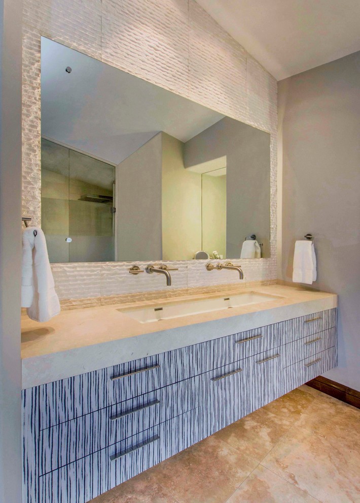 Inspiration for a large contemporary bathroom in San Diego with an undermount sink, flat-panel cabinets, limestone benchtops, a freestanding tub, stone tile, limestone floors, beige tile, grey walls and with a sauna.