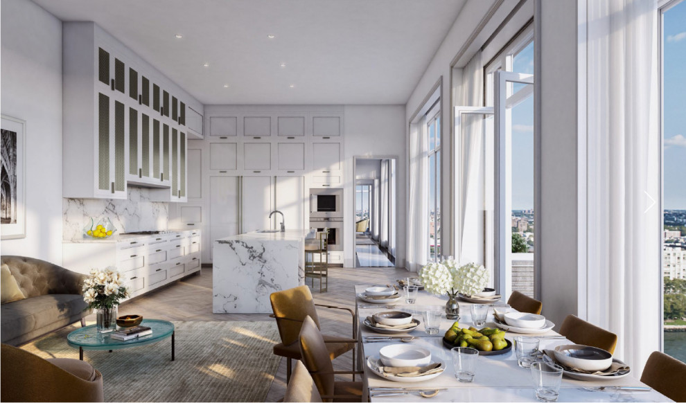 This is an example of an expansive transitional kitchen in New York with an undermount sink, recessed-panel cabinets, white cabinets, marble benchtops, white splashback, marble splashback, panelled appliances, medium hardwood floors, with island, multi-coloured floor and white benchtop.