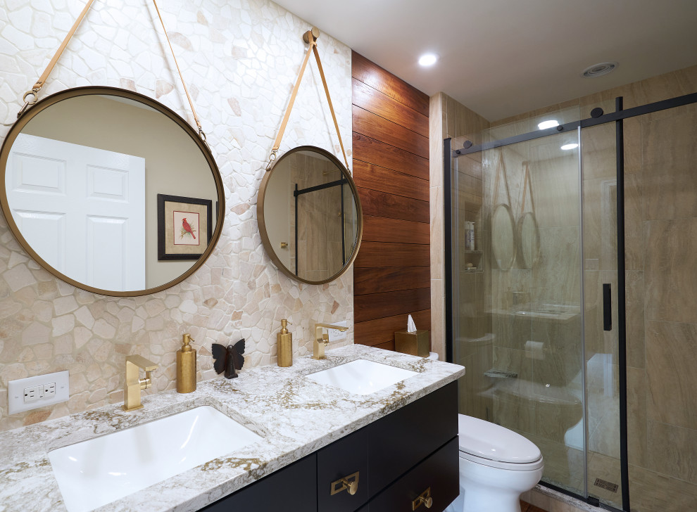 Inspiration for a mid-sized contemporary kids bathroom in Philadelphia with flat-panel cabinets, black cabinets, an alcove shower, a two-piece toilet, beige tile, porcelain tile, beige walls, porcelain floors, an undermount sink, engineered quartz benchtops, beige floor, a sliding shower screen and beige benchtops.