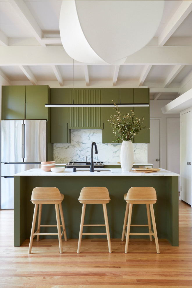 Inspiration for a small 1960s single-wall medium tone wood floor, brown floor and exposed beam open concept kitchen remodel in San Francisco with an undermount sink, flat-panel cabinets, green cabinets, marble countertops, white backsplash, marble backsplash, stainless steel appliances, an island and white countertops