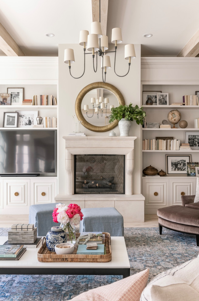 Inspiration for a timeless open concept light wood floor, beige floor and exposed beam living room remodel in Raleigh with white walls, a standard fireplace and a media wall