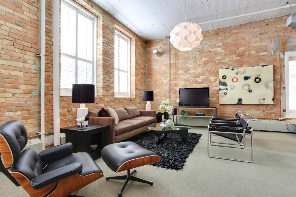 Urban concrete floor and gray floor family room photo in Calgary with red walls, no fireplace and a tv stand