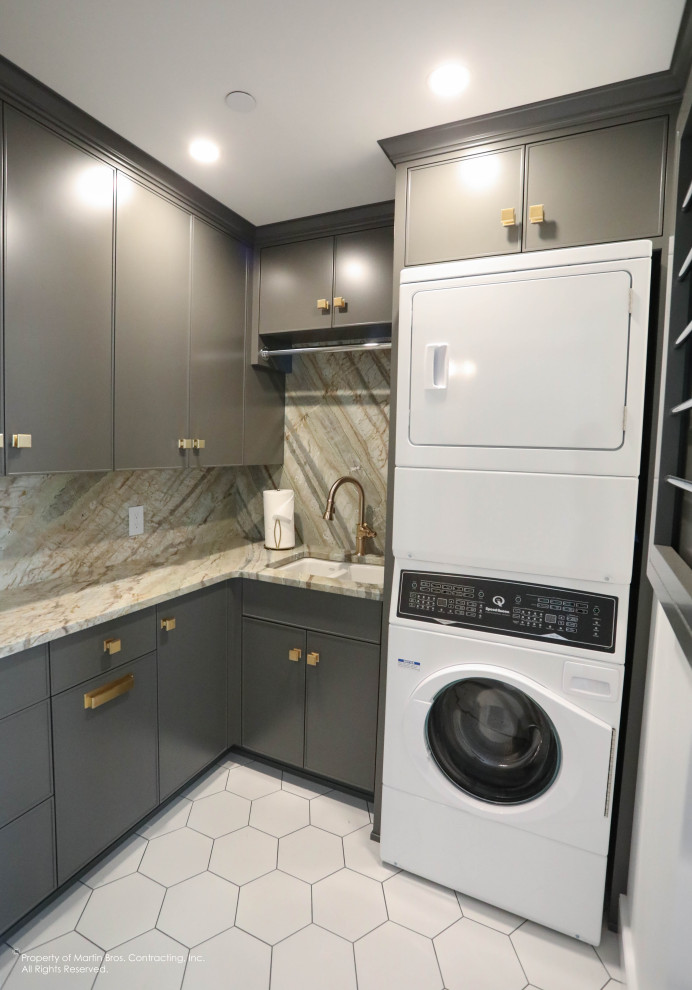 Inspiration for a mid-sized transitional l-shaped dedicated laundry room in Other with an undermount sink, flat-panel cabinets, grey cabinets, quartzite benchtops, stone slab splashback, white walls, porcelain floors, a stacked washer and dryer and white floor.