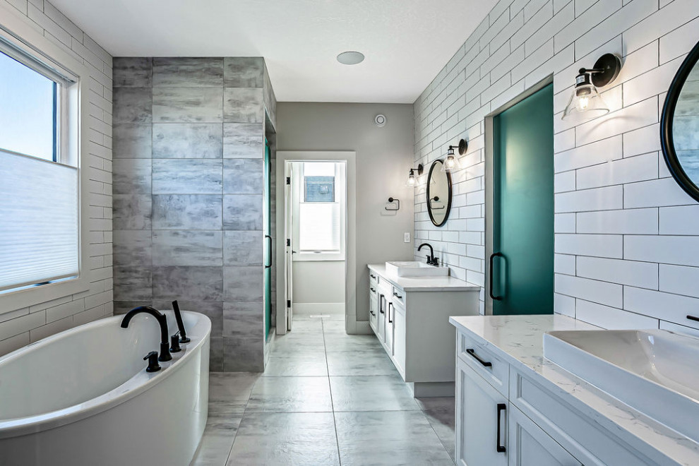 Transitional master white tile and ceramic tile ceramic tile, multicolored floor and double-sink freestanding bathtub photo in Calgary with shaker cabinets, white cabinets, a two-piece toilet, gray walls, a vessel sink, quartz countertops, a hinged shower door, white countertops and a built-in vanity