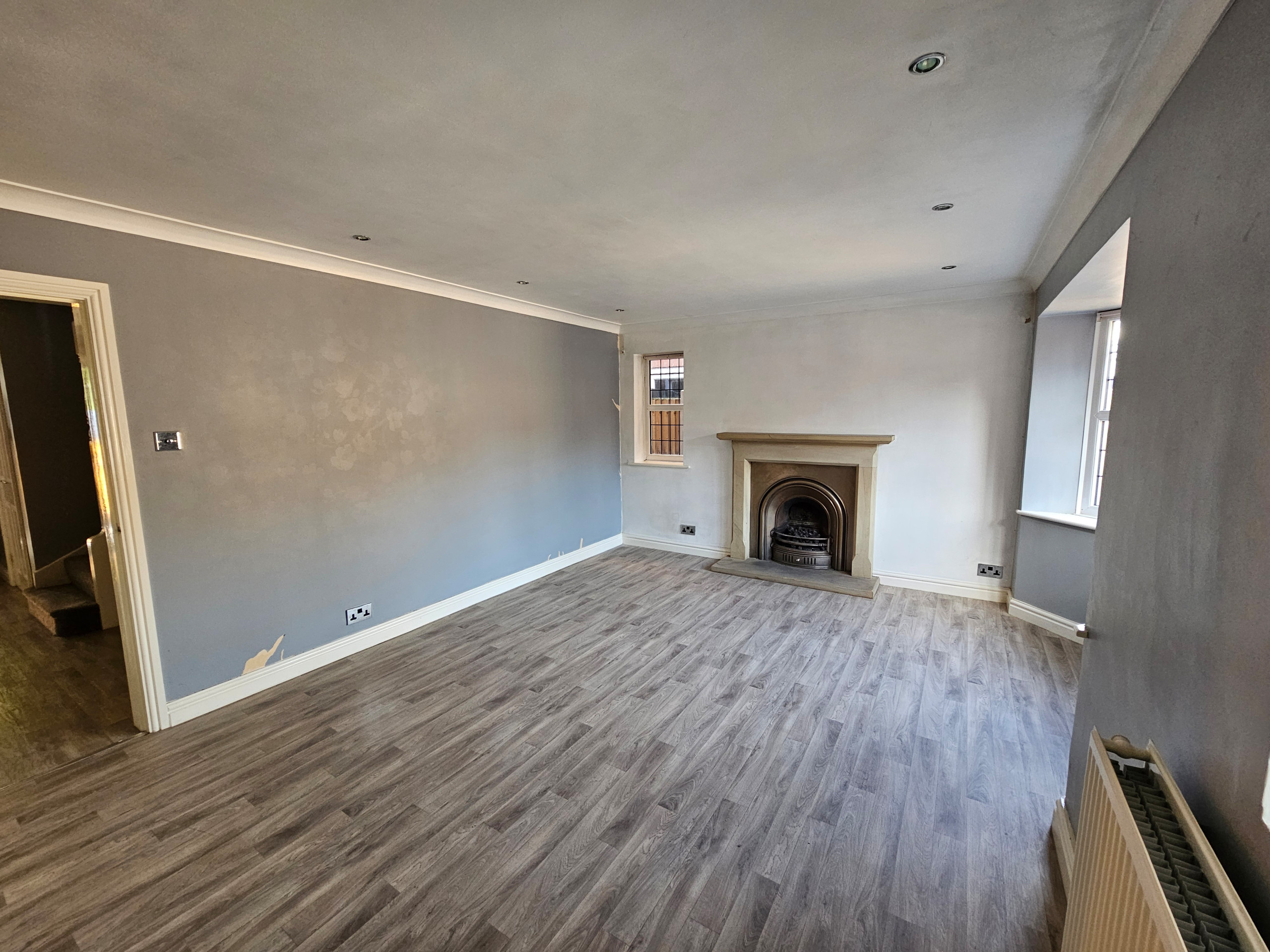 This before image shows the area where the new kitchen will be fitted, the door on the left will be bricked up as will the small window in the corner and the fireplace will be removed. The flooring wi