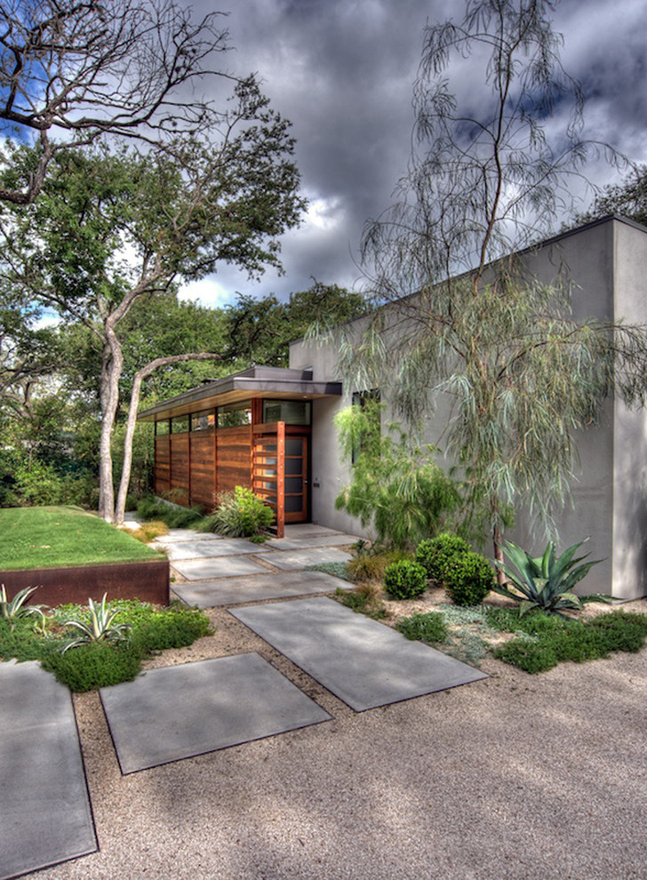 Design ideas for a contemporary front yard garden in Austin with concrete pavers.