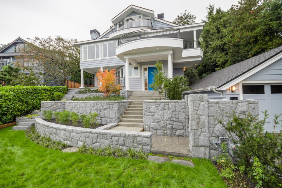 Inspiration for a large traditional three-storey grey exterior in Vancouver with a gable roof.