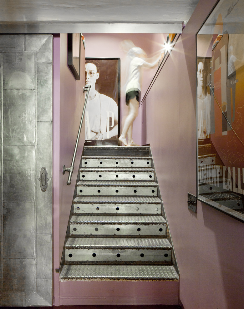 This is an example of an eclectic metal staircase in New York with metal risers.